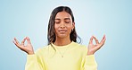 Lotus, breathe or woman in meditation in studio for wellness, peace or balance on blue background. Calm, hands or zen Indian girl in yoga pose for energy training, mental health or holistic exercise 