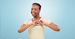 Heart, hands and woman love you in studio with kindness, care and charity donation on blue background. Happy portrait, african model and pointing with hope, thanks and emoji sign in support of peace