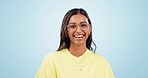 Optometry, smile and face of woman in studio with glasses for eye care, health or wellness. Happy, vision and portrait of young Indian female model cleaning her spectacles isolated by blue background