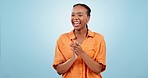 Woman, thumbs up and applause in studio for success, praise winner and congratulations on blue background. Happy african model clapping hands for celebration, support or celebrate winning achievement