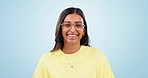 Optometry, vision and face of woman in studio with glasses for eye care, health or wellness. Happy, smile and portrait of young Indian female model cleaning her spectacles isolated by blue background