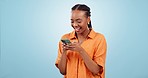 Woman, laugh and typing with phone in studio to update social media post, reading funny notification and chat on blue background. Happy african model download mobile app for meme, streaming and joke