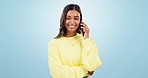 Phone call, talking or happy Indian woman in studio on blue background for communication or chat. Mobile, face or girl listening in conversation or speaking of good news or feedback for networking