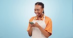 Smile, waitress and black woman with a smartphone, typing and contact on blue studio background. African person, girl and model with cellphone, digital app and mobile user with business communication