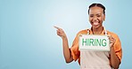 Woman, pointing and sign for hiring, information and recruitment offer in small business job or opportunity in blue background. Happy, manager or hand of entrepreneur with application menu or mockup