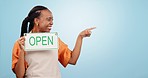 Excited, black woman and sign for mockup pointing for a restaurant or coffee shop deal. Happy, face portrait and African business owner or cafe employee with an open board and space for information