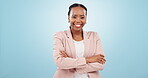 Black woman, business and arms crossed in portrait with smile, corporate career and confidence on blue background. Happy with job, mockup space and professional paralegal in studio with pride 