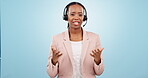 Callcenter, contact us and CRM, black woman and phone call with telecom or customer service on blue background. Communication, help desk and talking for telemarketing sales and consultant in a studio