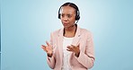Callcenter, stress with phone call and black woman is frustrated with CRM, customer service and telecom in studio. Help desk, fail or mistake with talk, communication and crisis on blue background 