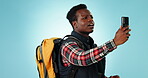 Hiking, cellphone GPS and Black man problem, lost and bad signal, network and search for connection, service or location. Studio smartphone, digital map reading and tourist lost on blue background