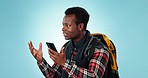 Hiking, fail and speaker phone by angry black man in studio with travel stress, lost or glitch on blue background. Smartphone, problem and male frustrated by app, 404 or map, location and guide error