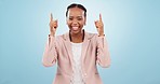 Business black woman, pointing up at information and presentation, mockup or workshop on blue background. Portrait, seminar at marketing agency and announcement, corporate ideas and speech in studio