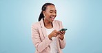 Black woman, typing and funny meme on social media, communication or laughing at online video on blue background. Happy, face and crazy comedy joke on internet, mobile app or chat on cellphone