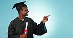 Graduation, education and black man point at college graduate info, college news or school checklist, plan or timeline. Diploma, studio portrait or student gesture at mockup space on blue background