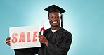 Graduation smile, sales sign and black man with university advertising, discount news info or college study announcement. Studio portrait, knowledge or student poster presentation on blue background