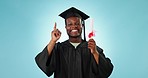 Graduation diploma, university student and black man point at college graduate info, scholarship news or school study. Success, portrait and happy studio gesture at education promo on blue background