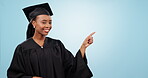 Graduation student, woman pointing and space for education, learning or college presentation on blue background. Face of african person with graduate information, registration steps or okay in studio