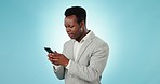 Angry, black man and phone with spam, phishing and digital fail and professional frustrated in studio. Mobile scam, employee with error on app with glitch and internet problem with blue background