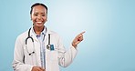 Happy black woman, doctor and pointing in marketing or advertising against a blue studio background. Portrait of female person, medical or healthcare professional with OK emoji showing list or steps