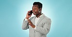 Businessman, phone and serious communication in studio for networking, discussion or conversation on blue background. Mobile, person and talking on smartphone for career chat, planning and assertive