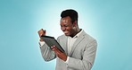 Happy black man, tablet and fist pump in celebration for promotion against a blue studio background. African businessman smile with technology for winning, good news or achievement on mockup space