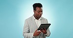 Tablet, stress and compliance with a business black man in studio on a blue background for problem solving. Technology, anxiety or 404 error with a corporate employee looking at a network issue