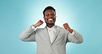 Happy black man, fist pump and applause in celebration for winning promotion against a blue studio background. Portrait of excited African businessman smile and clapping for good news or achievement