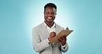 Black man, writing and clipboard for checklist, inspection or schedule planning against a blue studio background. Portrait of happy African businessman smile taking notes in business strategy or plan