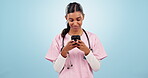 Doctor, woman and phone with healthcare communication, funny chat and telehealth service or social media in studio. Young nurse or student laughing with mobile and medical meme on a blue background