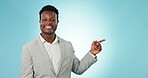 Face, business man and pointing to advertising choice in studio of deal, feedback or news on blue background. Portrait, happy worker and show presentation of launch, promotion or information about us