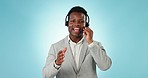 Man, consulting and call center communication in studio for customer service, FAQ advisory and IT questions. Portrait of african telemarketing agent, virtual assistant and salesman on blue background