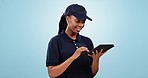 Happy black woman, tablet and research for communication or networking against a studio background. African female person or courier lady smile with technology for delivery, schedule or inventory