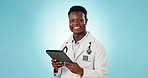 Black man, doctor and smile in portrait with tablet for online hospital schedule and health on blue background. Healthcare, wellness and tech with digital medical system with professional in studio