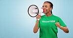 Woman, volunteer voice and megaphone for protest, support and call to action of sustainability or NGO in studio. African person speaking, volunteering and climate change or fight on a blue background