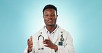 Video call, wave and a black man or doctor on a blue background for health communication. Happy, greeting and face portrait of an African healthcare employee speaking on a backdrop for medicine help