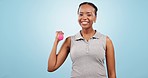 Face, dumbbells and black woman with exercise, fitness and wellness on a blue studio background. Portrait, African person and model with workout, performance and equipment with training and health 