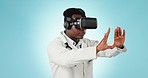 Doctor, medicine and future with virtual reality in studio on blue background for mockup. Black, person and healthcare for operation in procedure for examination with patient, treatment and hospital