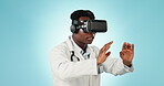 Metaverse, doctor or a black man with glasses on a blue background for futuristic healthcare. Typing, work and an African medical employee with a headset for virtual surgery or planning with ai or vr