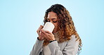 Happy, smelling and a woman with coffee on a blue background for relax, comfort and thinking. Smile, warm and a young girl with an idea, latte aroma and a tea drink on a backdrop in the morning