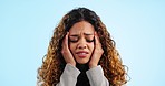 Business woman, pain and headache in studio for burnout, stress and bankruptcy risk on blue background. Face of tired, confused and sad worker with anxiety, brain fog and fatigue for doubt of mistake