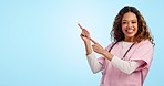 Mockup, excited woman or doctor pointing in studio for advice on healthcare, health insurance or medicine offer. Smile, help and nurse showing feedback, medical info and dancing on blue background.