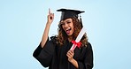 Happy woman, student and graduation pointing up with certificate in celebration for diploma against a studio background. Excited female person or graduate for achievement, degree or winning on mockup