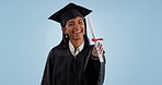 Portrait, education and woman with graduation, achievement and success on a blue studio background. Face, person and student with a degree, celebration and future with learning, smile and certificate