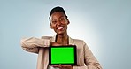 Black woman, tablet and green screen in advertising or marketing against a studio background. Portrait of happy African female person or employee smile showing technology app, display or mockup space