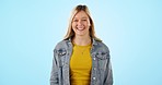 Young, woman and smile with happiness in studio on blue background for mockup. Caucasian, female model and laughing with face, calm and peaceful for relaxing, confidence and wellness in enjoyment