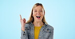 Thinking, face and a woman with an idea on a blue background for happiness or knowledge. Smile, vision and portrait of a young girl with creativity planning, decision or a choice on a backdrop