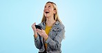 Winner, woman and phone with fist celebration in studio for promotion, success or achievement with excited face. Smartphone, person and happiness for reward, bonus or prize on mobile or network deal