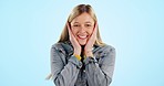 Wow, surprise and hands on face of woman in studio with news, announcement or giveaway on blue background. Emoji, portrait and female model shocked by secret, gossip or drama, promotion or deal info