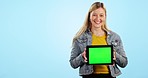 Girl, tablet and space with green screen in studio, promotion or brand review for app by blue background. Woman, student and face with digital touchscreen, mockup or happy for logo, sign and feedback