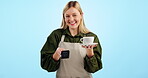 Waitress, coffee shop and card machine for digital POS payment, fintech or ecommerce service on blue background. Face of a barista, cashier or woman at point of sale or small business cafe in studio